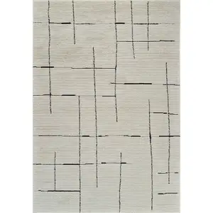 Photo of Cream and Green Abstract Distressed Area Rug