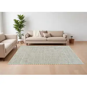 Photo of Cream and Green Abstract Distressed Area Rug