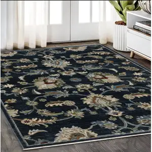 Photo of Dark Blue Tan And Green Oriental Area Rug With Fringe