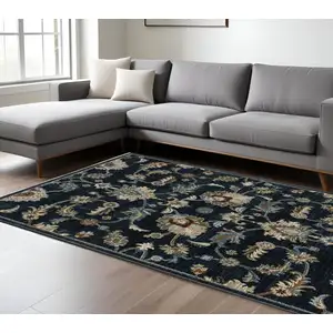 Photo of Dark Blue Tan And Green Oriental Area Rug With Fringe