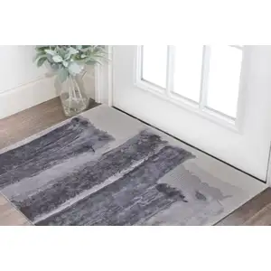 Photo of Dark Gray and Ivory Abstract Hand Tufted Area Rug