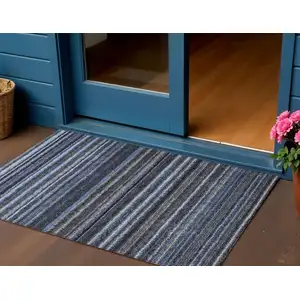 Photo of Denim Blue And Gray Striped Washable Indoor Outdoor Area Rug