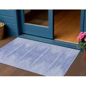 Photo of Denim Blue And Ivory Abstract Washable Indoor Outdoor Area Rug