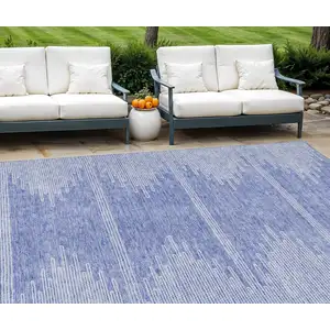 Photo of Denim Blue And Ivory Abstract Washable Indoor Outdoor Area Rug