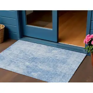 Photo of Denim Blue And Ivory Abstract Washable Indoor Outdoor Area Rug