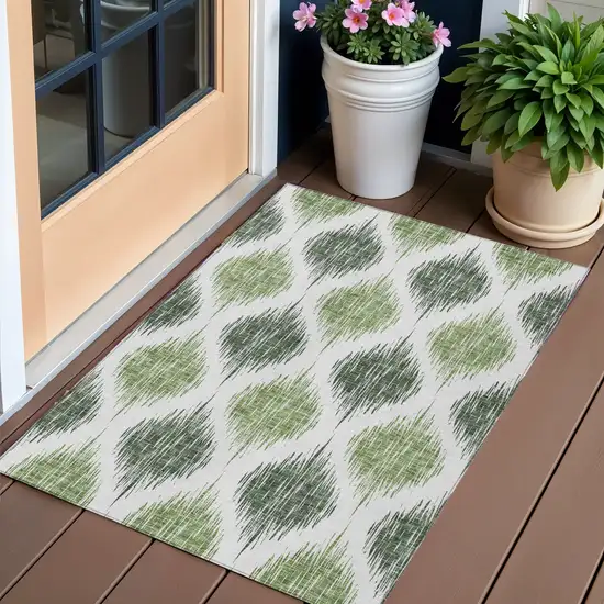 Fern Green And Ivory Ikat Washable Indoor Outdoor Area Rug Photo 1