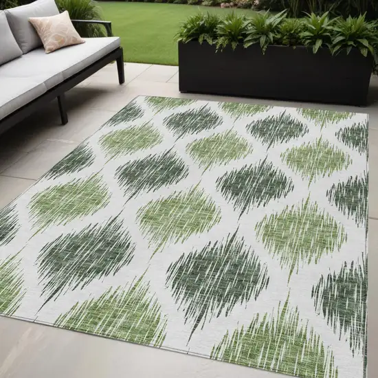 Fern Green And Ivory Ikat Washable Indoor Outdoor Area Rug Photo 1