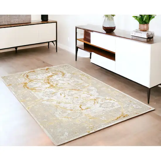 Gold Abstract Area Rug With Fringe Photo 1