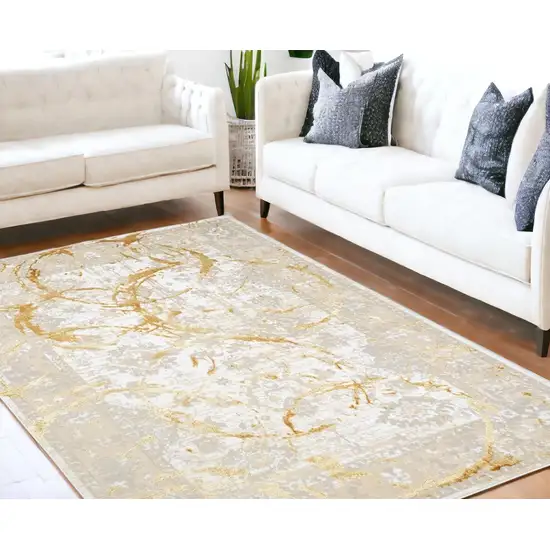 Gold Abstract Area Rug With Fringe Photo 1