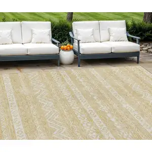 Photo of Gold And Beige Southwestern Washable Indoor Outdoor Area Rug