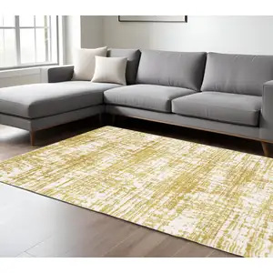 Photo of Gold And Ivory Abstract Area Rug