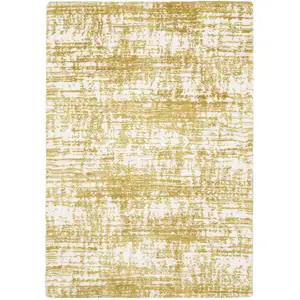 Photo of Gold And Ivory Abstract Area Rug