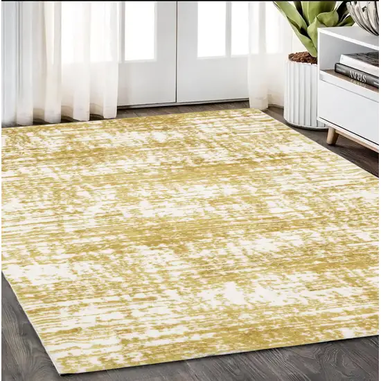 Gold And Ivory Abstract Area Rug Photo 1