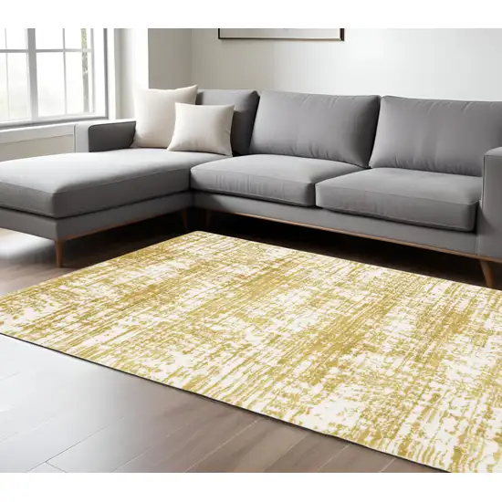 Gold And Ivory Abstract Area Rug Photo 1