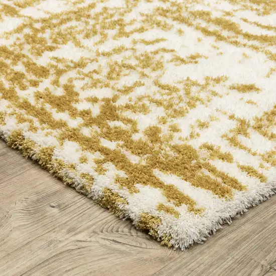 Gold And Ivory Abstract Area Rug Photo 8