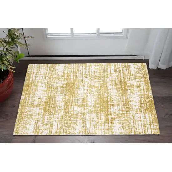 Gold And Ivory Abstract Area Rug Photo 1