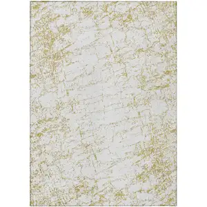 Photo of Gold And Ivory Abstract Washable Indoor Outdoor Area Rug