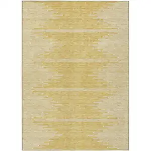 Photo of Gold And Ivory Abstract Washable Indoor Outdoor Area Rug