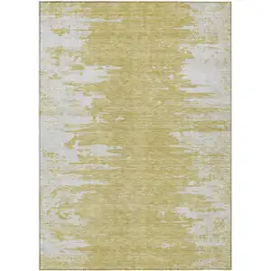 Photo of Gold And Ivory Abstract Washable Indoor Outdoor Area Rug