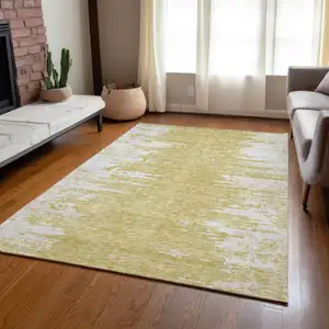 Photo of Gold And Ivory Abstract Washable Indoor Outdoor Area Rug