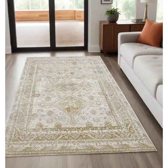 Gold And Ivory Floral Stain Resistant Area Rug Photo 1