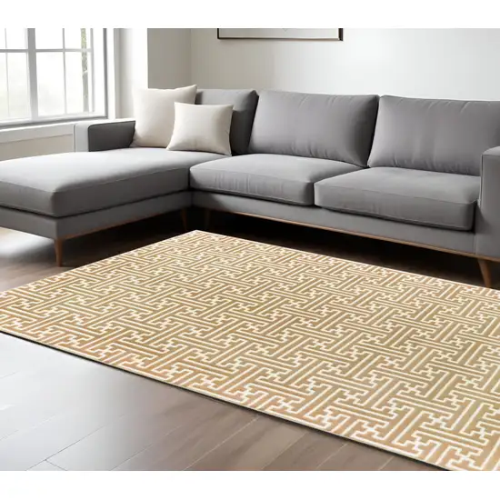 Gold and Ivory Geometric Power Loom Area Rug Photo 1