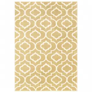 Photo of Gold And Ivory Geometric Power Loom Stain Resistant Area Rug