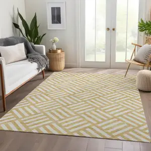 Photo of Gold And Ivory Geometric Washable Indoor Outdoor Area Rug