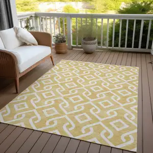 Photo of Gold And Ivory Geometric Washable Indoor Outdoor Area Rug