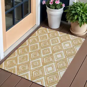 Photo of Gold And Ivory Geometric Washable Indoor Outdoor Area Rug