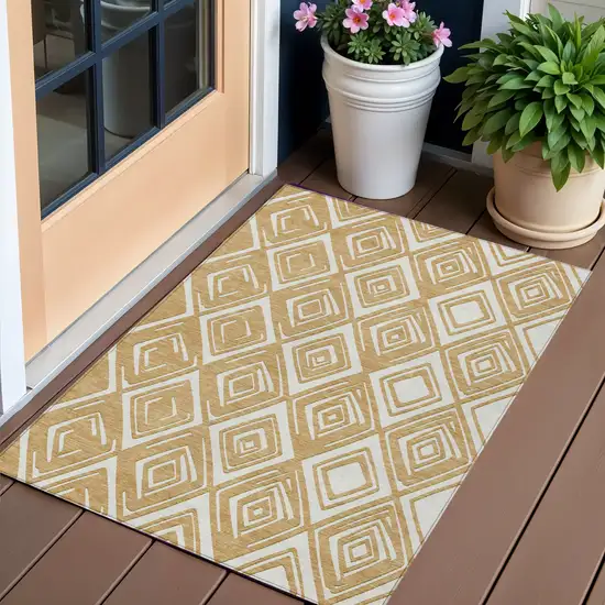 Gold And Ivory Geometric Washable Indoor Outdoor Area Rug Photo 1