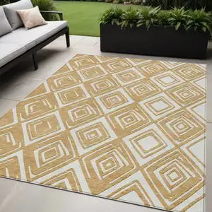 Photo of Gold And Ivory Geometric Washable Indoor Outdoor Area Rug