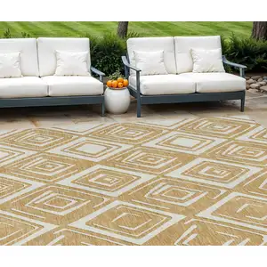 Photo of Gold And Ivory Geometric Washable Indoor Outdoor Area Rug