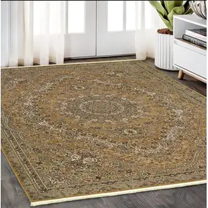 Photo of Gold And Ivory Medallion Area Rug With Fringe