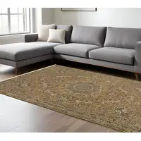 Photo of Gold And Ivory Medallion Area Rug With Fringe