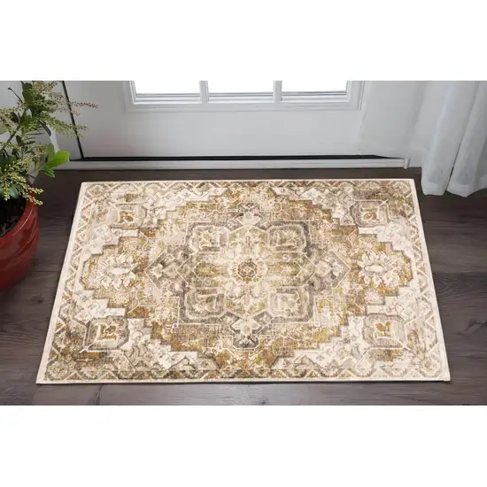 Gold And Ivory Oriental Power Loom Stain Resistant Area Rug With Fringe Photo 1