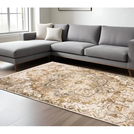 6' X 9' Gold And Ivory Oriental Power Loom Stain Resistant Area Rug With Fringe Photo 1