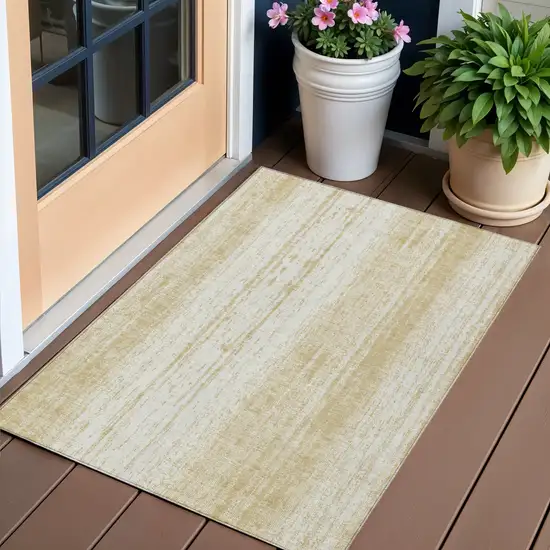 Gold And Ivory Striped Washable Indoor Outdoor Area Rug Photo 1