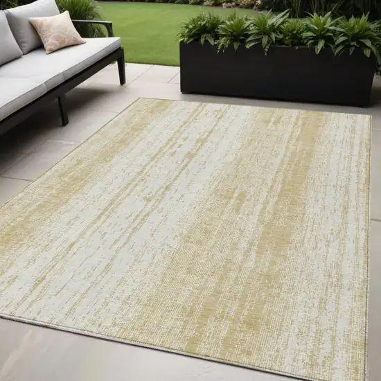 Gold And Ivory Striped Washable Indoor Outdoor Area Rug Photo 1