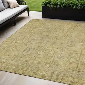 Photo of Gold And Taupe Southwestern Washable Indoor Outdoor Area Rug