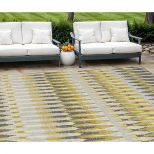 Photo of Gold Beige And Gray Southwestern Washable Indoor Outdoor Area Rug