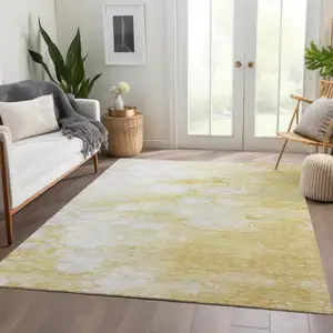 Photo of Gold Beige And Ivory Abstract Washable Indoor Outdoor Area Rug