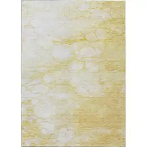 Photo of Gold Beige And Ivory Abstract Washable Indoor Outdoor Area Rug