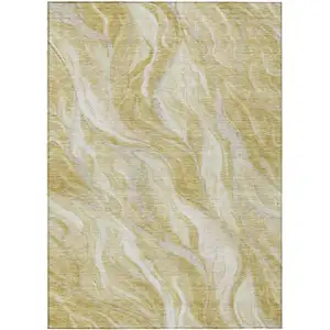 Photo of Gold Beige And Ivory Abstract Washable Indoor Outdoor Area Rug