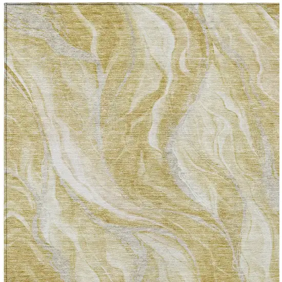 Gold Beige And Ivory Abstract Washable Indoor Outdoor Area Rug Photo 4