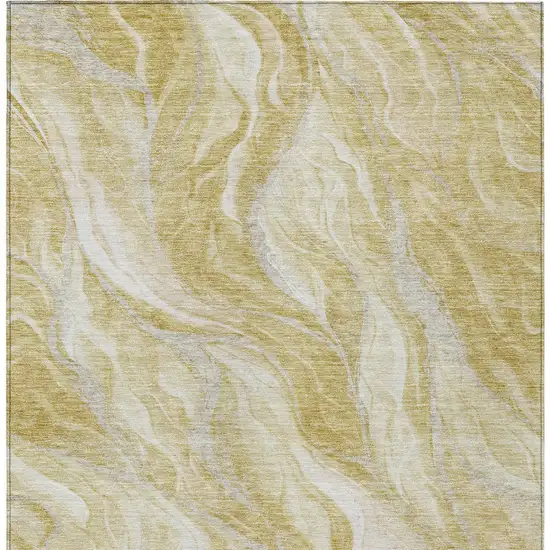 Gold Beige And Ivory Abstract Washable Indoor Outdoor Area Rug Photo 5