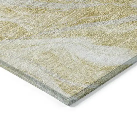 Gold Beige And Ivory Abstract Washable Indoor Outdoor Area Rug Photo 3