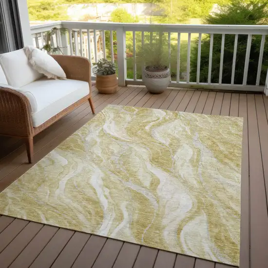 Gold Beige And Ivory Abstract Washable Indoor Outdoor Area Rug Photo 6