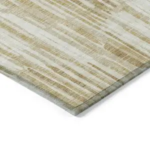 Photo of Gold Beige And Ivory Abstract Washable Indoor Outdoor Area Rug