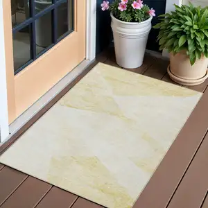 Photo of Gold Beige And Ivory Abstract Washable Indoor Outdoor Area Rug